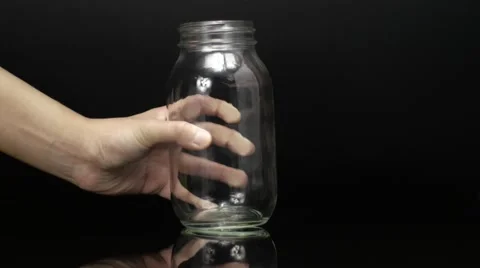 Glass Jar on Table Stockbeeldmateriaal 61325211