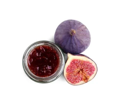 Glass jar of tasty sweet fig jam isolated on white, top view Stock Photos