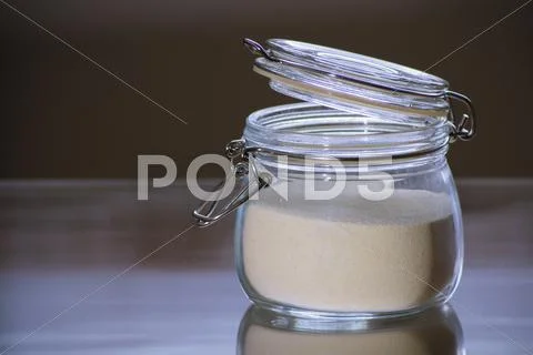 Glass jar with white flour Stock Photos