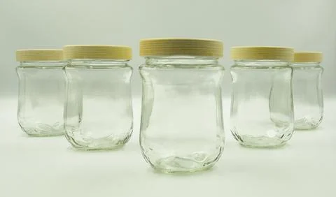 Glass jars on a white background Stock Photos