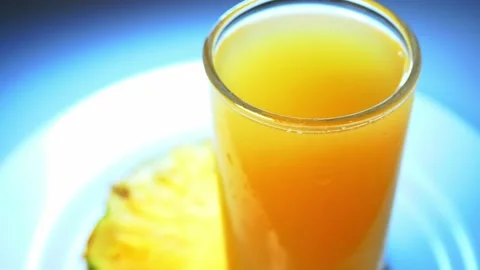 A glass of juice and pineapple Stock Footage 226336640