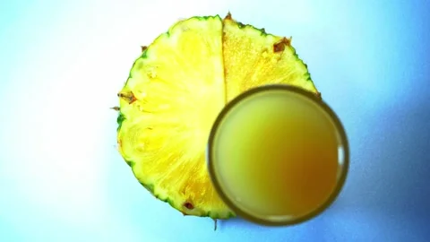 A glass of juice and pineapple Stock Footage 226338189