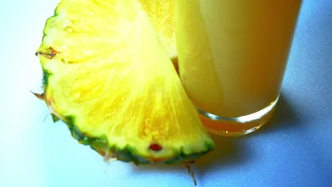 A glass of juice and pineapple Stock Footage 226339805