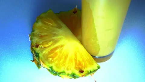 A glass of juice and pineapple Stock Footage 226342272