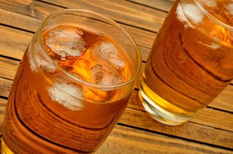 Glass with juice on table Stock Photos