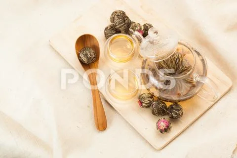 Glass kettle and two bowls for chinese tea. Stock Photos