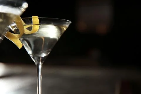 Glass of lemon drop martini cocktail in bar, closeup. Space for text Stock Photos