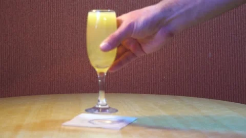 Glass with lemon juice on the table Video stock 196572856