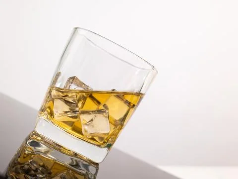 Glass for liquor Translucent elements made of glass are placed on a tilted .. Stock Photos