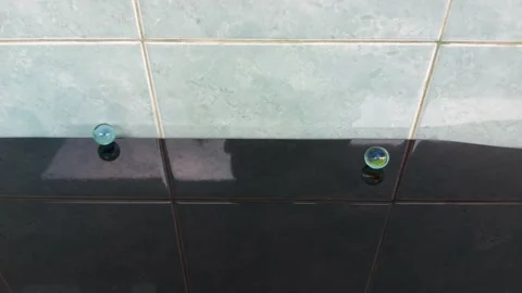 Glass marble balls playing rolling Stock Footage 209145518