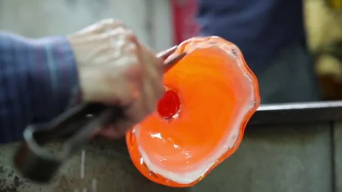 Glass master makes a shape in Glass studio, Murano, Italy Stock Footage 72965879