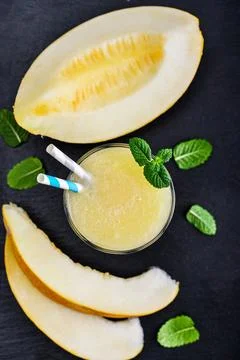 Glass of melon smoothie Stock Photos
