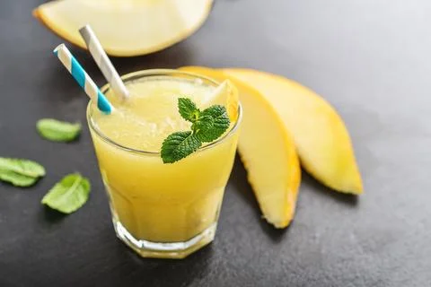 Glass of melon smoothie Stock Photos