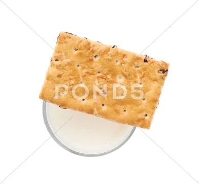 Glass of milk and cookie isolated over the white background Stock Photos