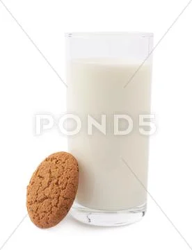 Glass of milk and cookie isolated over the white background Stock Photos