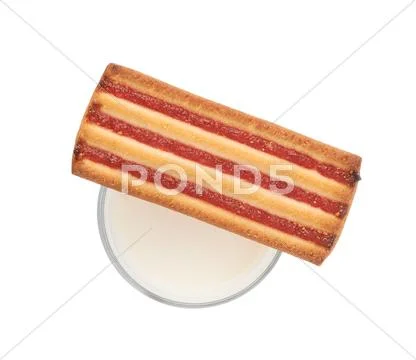 Glass of milk and cookie isolated over the white background Stock Photos