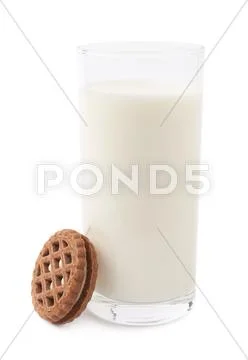 Glass of milk and cookie isolated over the white background Stock Photos