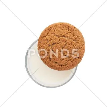 Glass of milk and cookie isolated over the white background Stock Photos