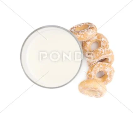 Glass of milk and cookie isolated over the white background Stock Photos