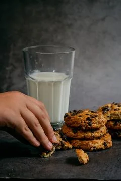 A glass of milk and a stack of biscuits 스톡 사진