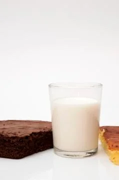 Glass of milk with different biscuits Stock Photos