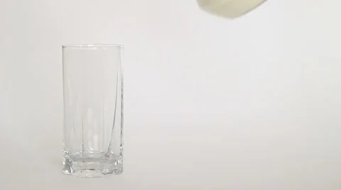 Glass of milk on a light background Stock Footage 1071433