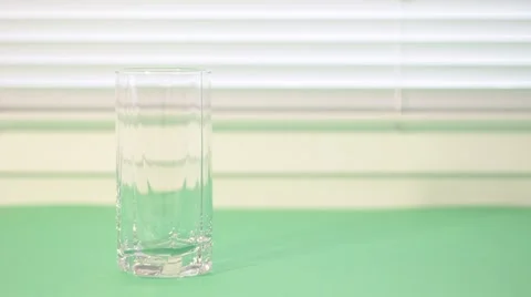 Glass of milk on a light background Stock Footage 1071437