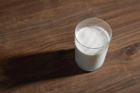 Glass of milk on the table. Stock Photos