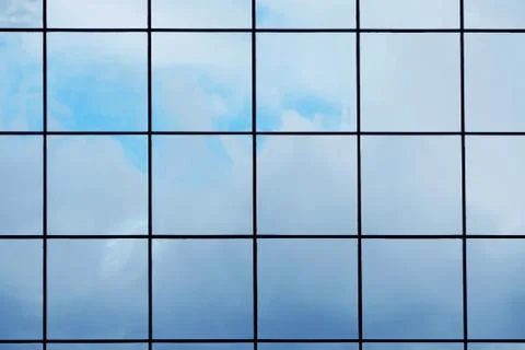 Glass with mirror effect in frames, facing of a modern office building Stock Photos