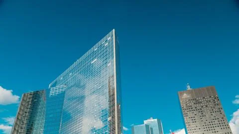 Glass mirror surface skyscraper timelapse in famous financial and business di Stock Photos