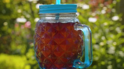 Glass mug with cold fruit drink Stock Footage 137622378