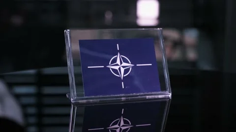 Glass Nato Flag Rotating On Table 動画素材 208507765