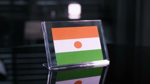 Glass Niger Flag Rotating On Table 動画素材 208509622