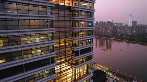 Glass office facade and river skyline in fading daylight in Guangzhou China Video stock 346032475