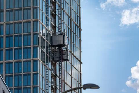 Glass Office Tower With External Construction Elevator in Berlin 스톡 사진