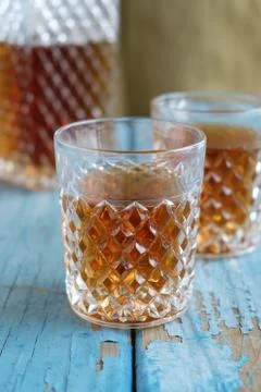 Glass on an old table Stock Photos