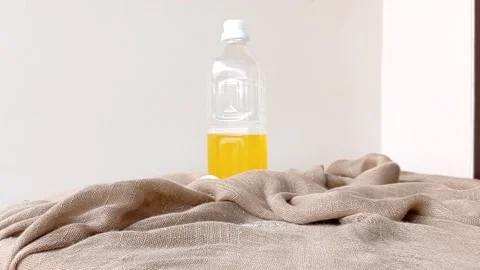 A glass of orange juice on a table Stock Footage 146249479