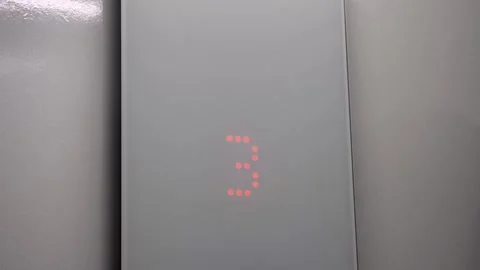 Glass panel of a modern elevator descends Stock Footage 274472366