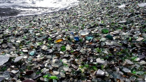 Glass pebbles on beach Stock Footage 118693927