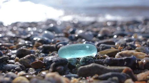 Glass pebbles on beach Stock Footage 118694099