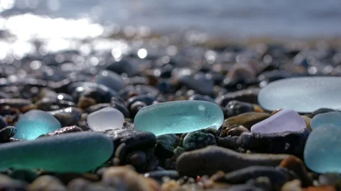 Glass pebbles on beach Stock Footage 118694246