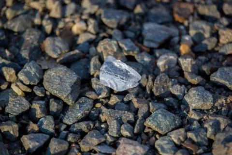 Glass on pebbles 스톡 사진