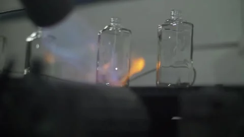 Glass perfume flasks being heated Stock Footage 271353643