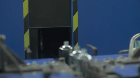 Glass perfume flasks entering machine Stock Footage 271353658