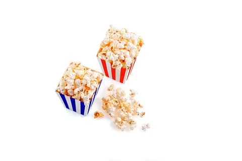 Glass with popcorn on a white background Stock Photos