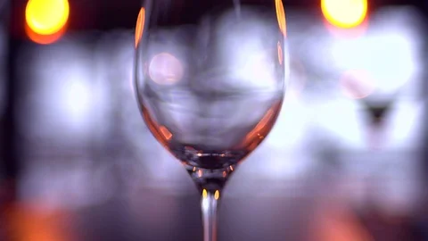 In a glass pour red wine Stock Footage 74955014