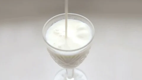 In a glass is poured milk Stock Footage 72141240