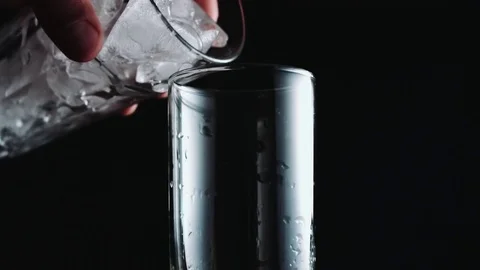 Glass is poured with water Stock-Footage 70644268