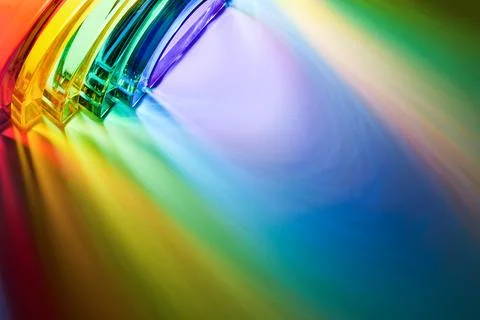 Glass prism refracting light creating vibrant spectrum colors 스톡 사진