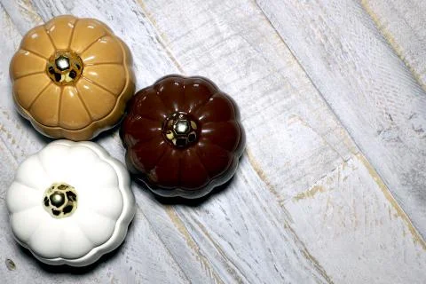 Glass Pumpkins against distressed wooden surface backbround Stock Photos